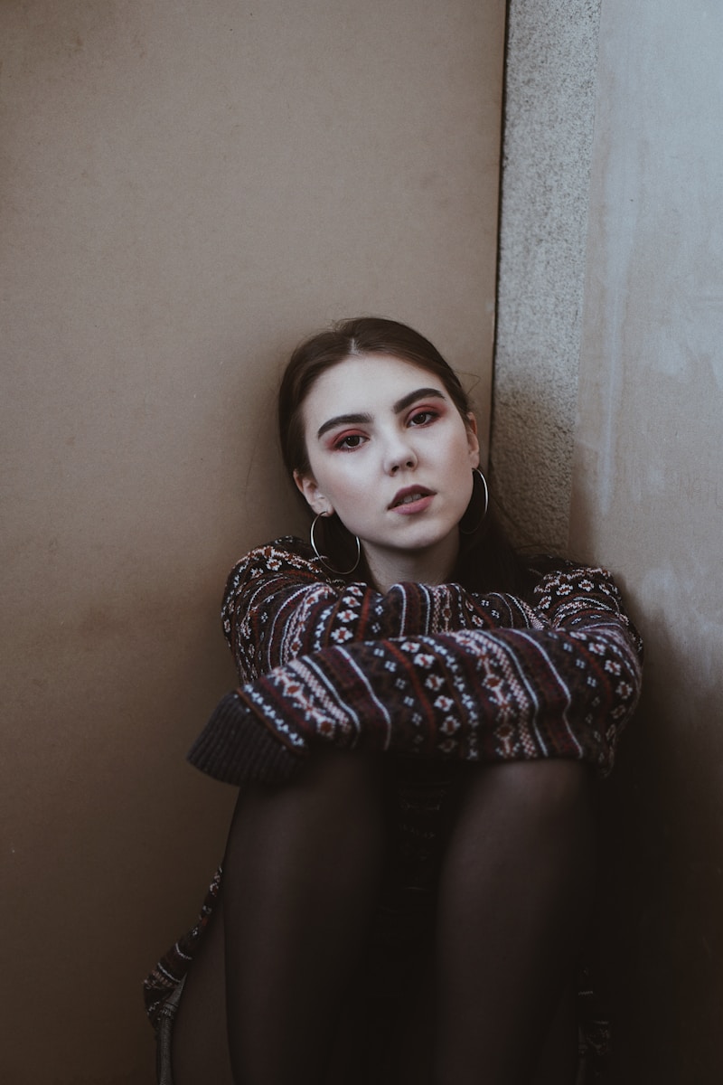 woman leaning on wall